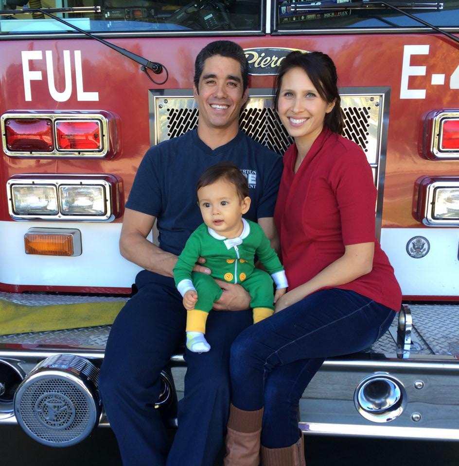 Mochizukis paid off six-figure debt in 33 months. Kyle, Lauren, Owen at the fire station.