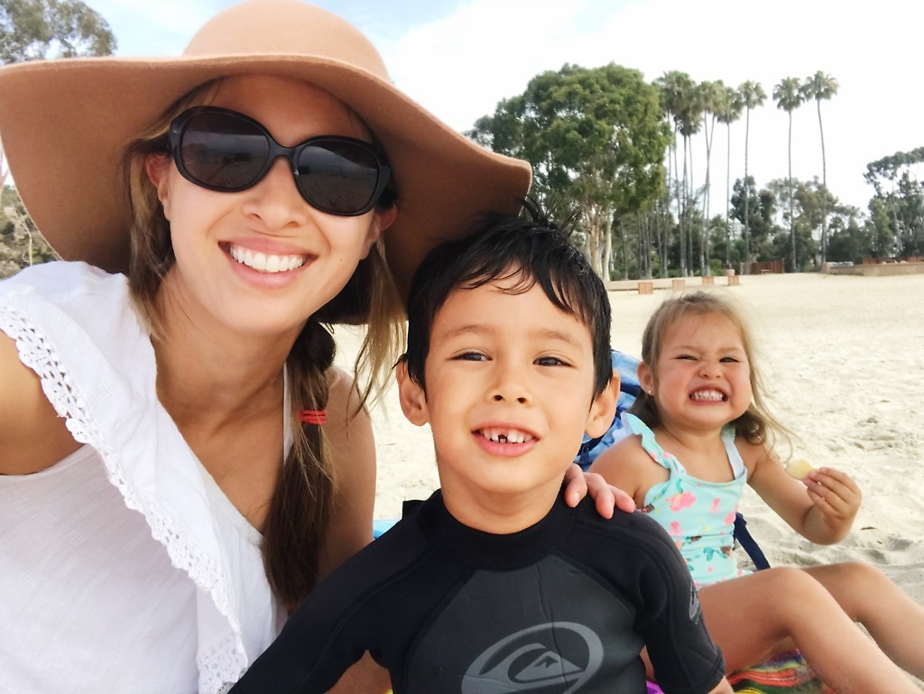 Mochizukis paid off six-figure debt in 33 months. Lauren and the kids at the beach.