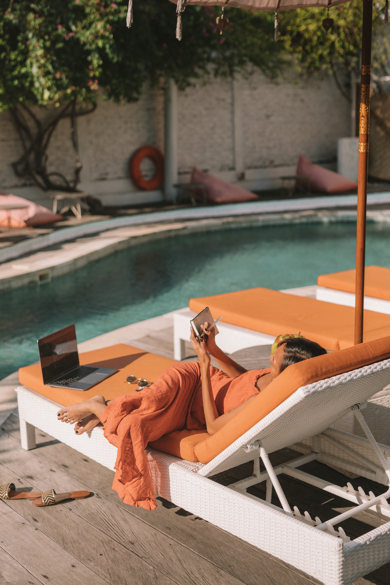 Woman planning by the pool